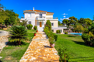 Wide aerial shot of modern house and property grounds